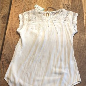 New: never worn. White Lace detail blouse.